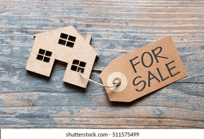 Small House With For Sale Sign