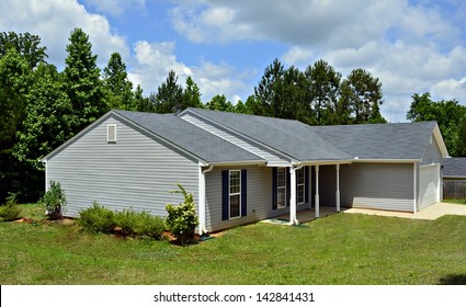 A Small House With Vinyl Siding.