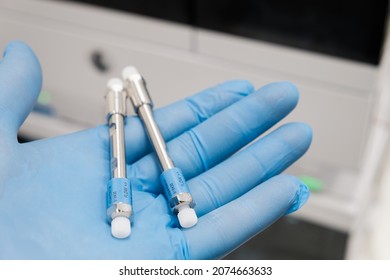 Small HPLC 50 Mm Columns For Separation Compounds In Laboratory Worker Hand In Rubber Glove. Fast High Performance Liquid Chromatography Analysis In Chemical And Microbiological Laboratory. Clinical