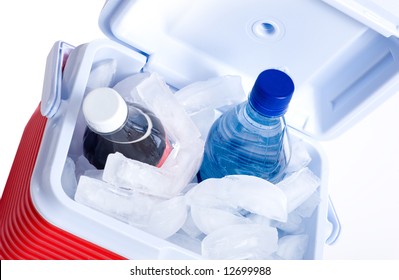 A Small Ice Chest Or Cooler With Drink Including A Cola And A Bottle Of Water