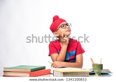 small Indian/sikh boy studying at study table with books Stock fotó © 