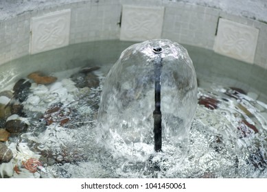 Small Indoor Fountain In A Pool With Decorative Stones, Pebbles And Rocks. Clean Water 