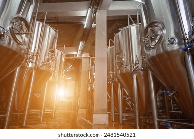 A small industry brewery's brewing tanks in a brewery that produces craft beer - Powered by Shutterstock