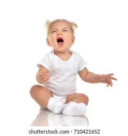 Small Infant Child Baby Girl Toddler Sitting And Screaming Yelling Crying Looking Up Isolated On A White Background