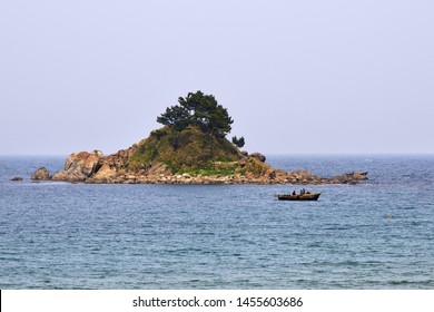 Small Island And Fishing Boat In Sea Of Japan Or East Sea. East Coast Of North Korea