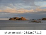 Small islands covered by colorful trees and rock formation, Lake Vanern, Sweden.