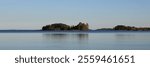 Small islands covered by forest in Lake Vanern, Sweden.