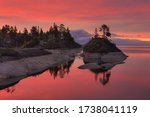 Small Islands on the lake in the pink dawn, lake Ladoga, Republic of Karelia, Russia