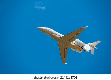 Small Jet Airplane With Sky Background Taking Off