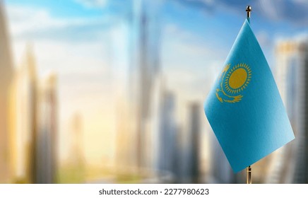 A small Kazakhstan flag on an abstract blurry background. - Shutterstock ID 2277980623