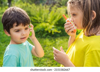 Small kids,girls play in walkie-talkie.Walkie Talkies with channels.Game of detectives, spies.Children talk,say messages at distance.Communication with parents in forest,park,hike.Finding lost people.