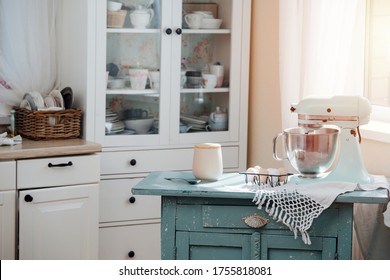 Small Kitchen With Cramped Cabinet. Old Table In The Middle With Mixer And Eggs For Baking Cake.