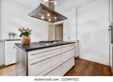 Small Kitchen With Island And Hood Over The Island