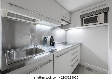 Small Kitchen With Stainless Steel Worktop In Vacation Rental Apartment