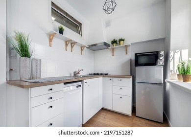 Small kitchen in white finishing - moder interior design - Shutterstock ID 2197151287