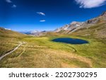 A small lake in a mountain pasture. Small mountain lake view