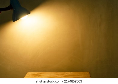 Small lamp with brown light shine to the wall. Spot light concept.