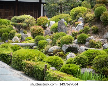 Small landscape garden with a water stream, stone bridges and water lilies at Kaizando hall of Tofukuji temple in Kyoto, Japan