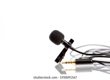 Small Lavalier Microphone Or Lapel Mic On White Background. Professional Sound Recording Equipment For Cell Phone.