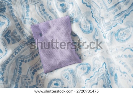 Small lavender sachet on patterned fabric