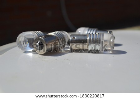 small LED bulbs in a metal frame on a light background