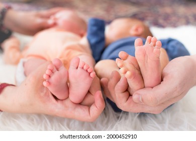 Small Legs Of Newborn Premature Twins And One Of Baby Have Neonatal Jaundice.