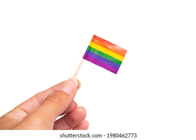 Small LGBT Flag In Hand Isolated On White Background Close Up