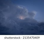 Small lightning in the midst of storm clouds