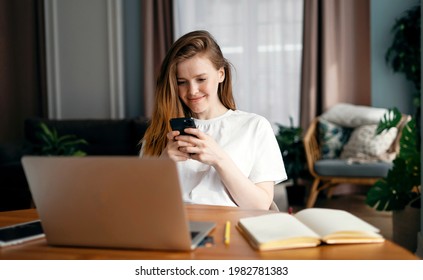 A small loan is issued on the bank's website by a woman of European appearance. Uses a mobile phone in the hands of a break. Makes online purchases with a credit card in an online store.