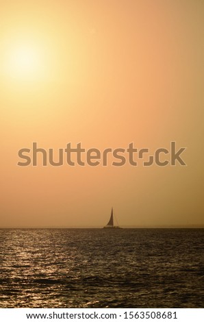 Similar – Silhouette einer ägyptischen Stadt mit Segelboot im Vordergrund und pastellrosa-lila farbenem Himmel, Sonnenuntergangsstimmung