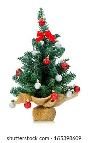 Small And Lovely Decorated Christmas Tree Isolated On White Background. 