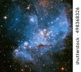 The Small Magellanic Cloud is a dwarf irregular galaxy near the Milky Way, located 210,000 light-years away. Retouched colored image. Elements of this image furnished by NASA.