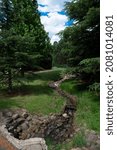 Small man made stream between the trees