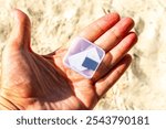 Small memory card micro sd in the box in your hand on the beach in Playa del Carmen Quintana Roo Mexico.