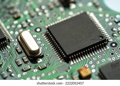 Small microprocessor, microcontroller chip on a generic modern desktop PC computer motherboard, object macro, extreme closeup, shallow dof, nobody Electrical components shortage concept, circuit board