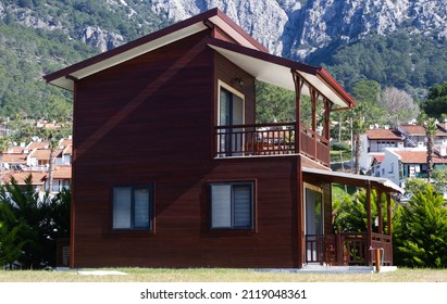 
A Small And Minimalist Wooden House With Two Floors. 