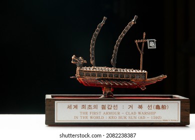 A Small Model Of Famous Ancient Korean Ironclad War Ship. Korean Turtle Ship On A Black Background.