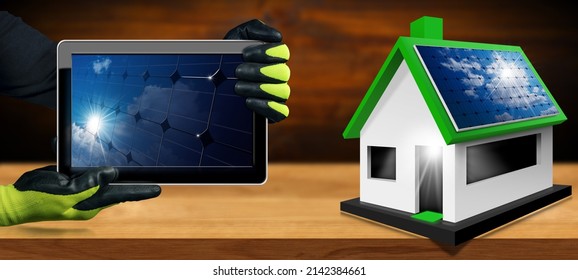 Small Model House With Solar Panels On The Roof And Manual Worker With Protective Work Gloves Showing A Digital Tablet Computer With A Close-up Of A Solar Panel Inside The Screen. 