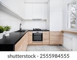 Small modern kitchen in an apartment building.
