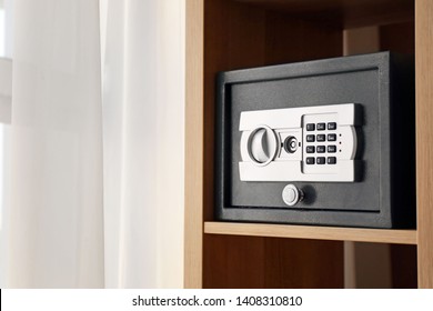 Small modern safe on shelf