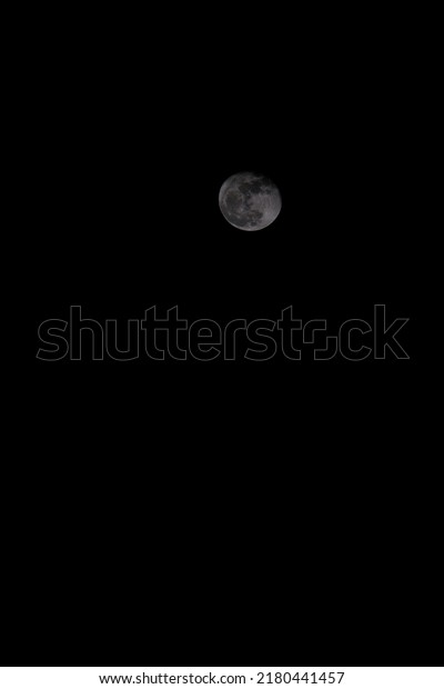 small moon in the black night background for
quote concept