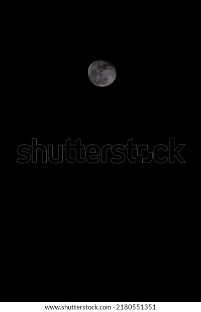 small moon in the black night background for\
quote concept