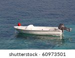 Small motor boat on the silent sea