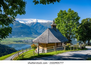 Small mountain chapel in Zell am See, in the background the impressive snow-covered Kitzsteinhorn, Salzburg, Austria, Europe - Shutterstock ID 2102905777