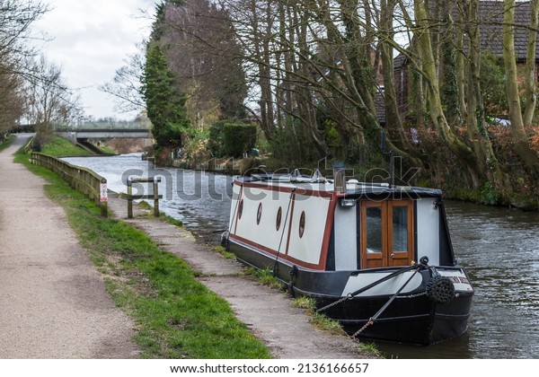A small narrow boat\
pictured in March 2022 on the Leeds Liverpool canal at Rufford in\
Lancashire.
