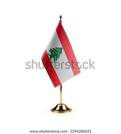 Small national flag of the Lebanon on a white background.
