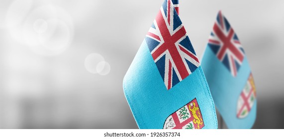Small national flags of the Fiji on a light blurry background - Shutterstock ID 1926357374