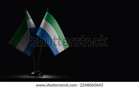 Small national flags of the Sierra Leone on a black background. Stock photo © 