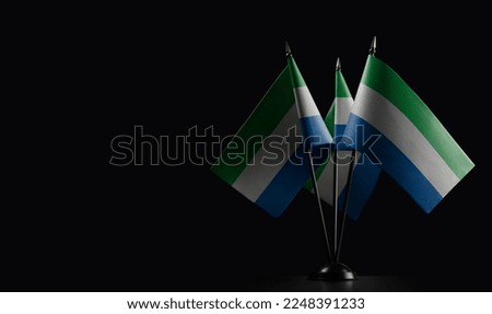 Small national flags of the Sierra Leone on a black background. Stock photo © 