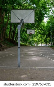 a small neighborhood basketball court, a well-kept basketball court in a housing estate, a team game field for city residents, a playground in a city park. Unoccupied basketball playground - Shutterstock ID 2197687031